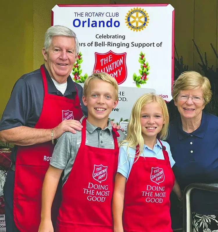 Rotary Club of Orlando members ringing bells for the Salvation Army