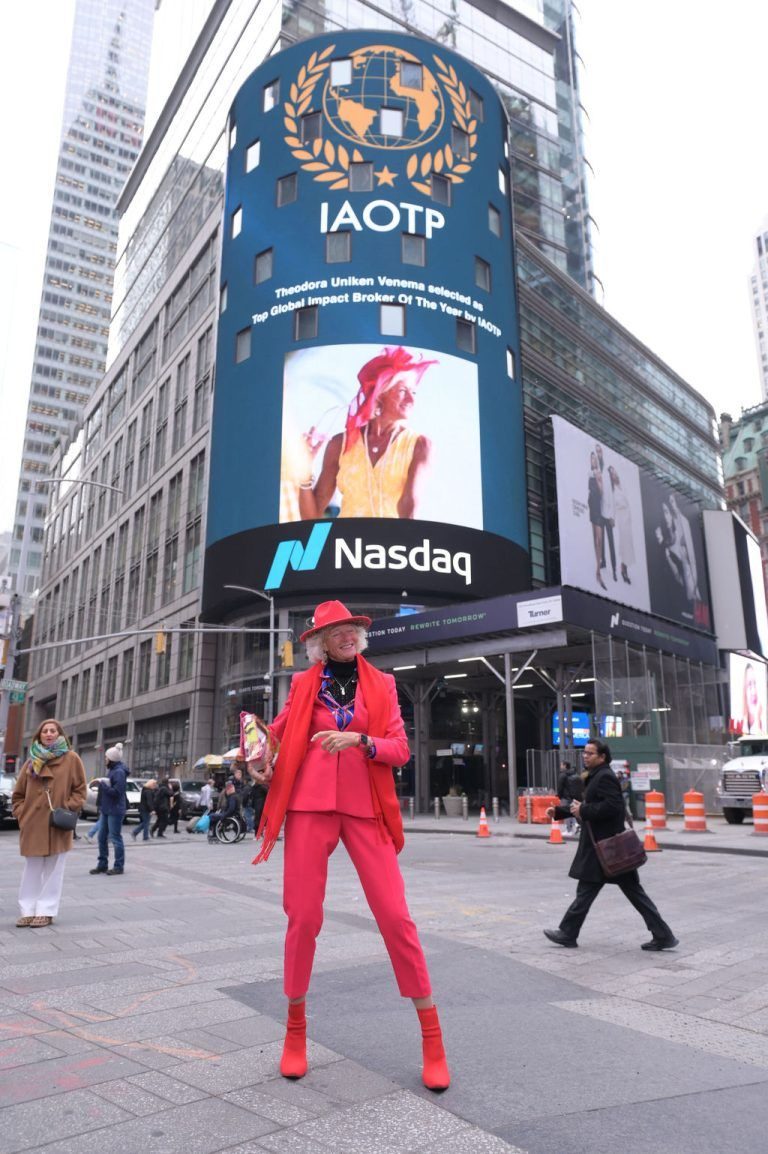 Theodora below her IAOTP feature on the Times Square billboard